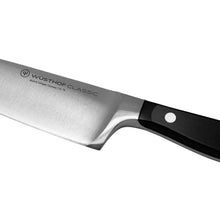 Wüsthof Classic chef's knife blade with black handle, logo side view