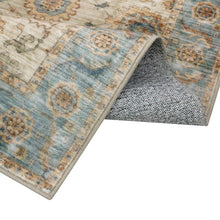 Washable indoor area rug corner with bound edge and textured gray underside backing
