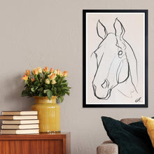 Black framed wall art print showing a black-and-white horse line sketch.