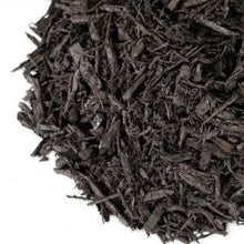 Black shredded wood mulch pieces piled