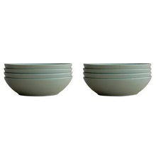 Two stacked mint green ceramic bowls with wide open top