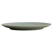 Light green round dinner plate with smooth, wide rim