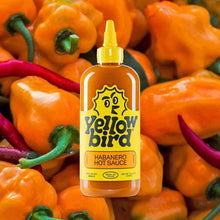 Habanero hot sauce bottle with Yellowbird label and yellow dispensing cap