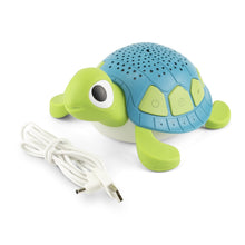 Green and blue turtle sound machine with white power cord and starry dome