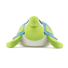 Green and blue turtle-shaped sound machine viewed from the front