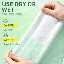 White disposable face towel held in hand, textured wipe sheet