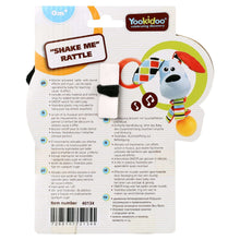 Shake Me rattle packaging card with dog figure and printed instructions