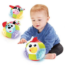 Light-up plush ball with cow face, colorful panels and red ear, motion glow