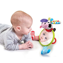 Cow-shaped baby mirror and rattle toy with green frame and striped legs
