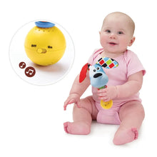 Dog-themed baby rattle toy in use with baby, yellow on/off ball and blue head