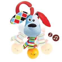 Dog-shaped fabric baby rattle with red handle, geometric ears, yellow ball and striped body
