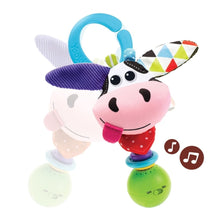 Pink cow plush rattle with blue handle ring and patterned fabric wing