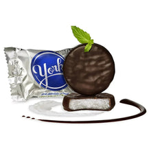 Wrapped dark chocolate peppermint patty with mint leaf and creamy center