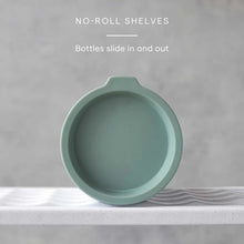 Bottle mug and plate organizer with a green dish sliding into the shelf