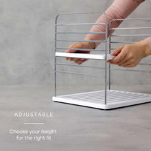 Adjustable bottle mug and plate organizer with hand adjusting the upper frame