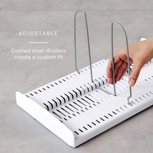 Adjustable white cookware organizer tray with coated steel divider bars standing upright