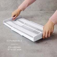 Expandable white cookware organizer tray with slotted dividers and adjustable length sections