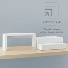 White tiered can organizer with multiple steps for adjustable shelf depth