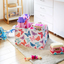Butterfly patterned kids collapsible storage trunk filled with toys on a living room rug