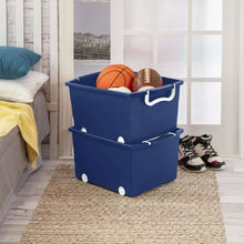 Kids rolling toy storage bin with handle, blue, with toys and shoes nearby