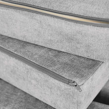Gray play fort cushion with visible zipper track and textured upholstery