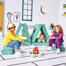 Teal-green kids convertible play fort with folded ramp pieces and cube entry side