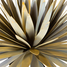 Yucca sculpture close-up of radial steel leaves around a round center