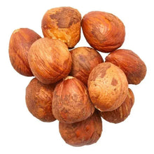 Raw shelled hazelnuts, whole pieces in a pile