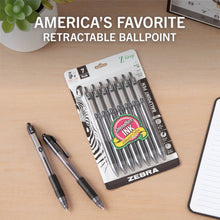 Retractable ballpoint pen set, black ink 7-pack, two pens on a desk