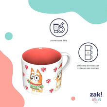 Ceramic holiday mug with fox and penguin character print and red interior