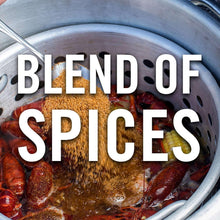 Crawfish boil in a steamer pot with seasoning blend and corn