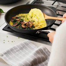 Zwillings non-stick skillet, black pan with omelet and herbs