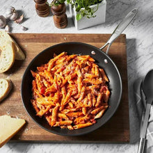 Zwillings non-stick frying pan, black skillet holding cooked pasta
