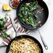 Zwillings non-stick frying pans, black skillets with greens and noodles