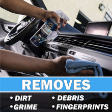Detailing bottle being used to clean car interior vents and console with cloth