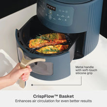 Atlantic Blue air fryer with open basket, roasted food inside and front lever handle