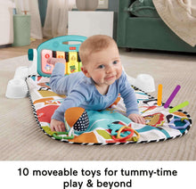 Blue activity playmat with arched piano toy and baby sitting while playing