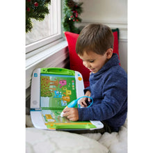 Child using a LeapFrog® LeapStart® learning system near a window