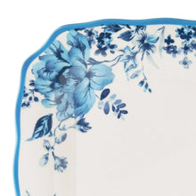 Blue and white floral stoneware dinner plate with scalloped rim