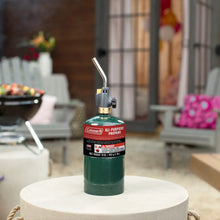 Green upright propane cylinder with white Coleman All-Purpose label and nozzle