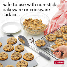 Dark gray nylon turner and spoon with stainless handles for lifting baked cookies