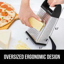 Box grater used on a cutting board with a lemon being grated