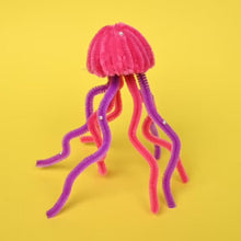 Fuzzy chenille stick jellyfish craft with pink top and purple tentacles