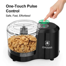 Black electric food chopper with pulse button and chopped nuts in clear bowl