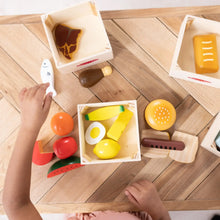 Wooden food groups set with crates and scattered food pieces on floor