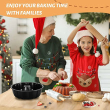 Black bundt cake pan held by hands on a holiday baking table.