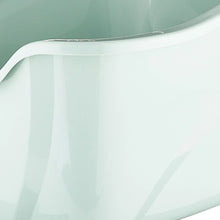 Close-up of hooded cat litter box rim, showing mint interior and white edge