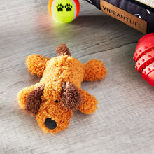 Plush orange dog chew toy with brown face patches and black squeaker opening