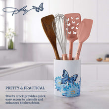 White stoneware crock with blue butterfly floral print, holding kitchen utensils