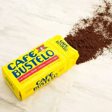 CafŽ Bustelo espresso ground coffee brick pack with mound of ground coffee